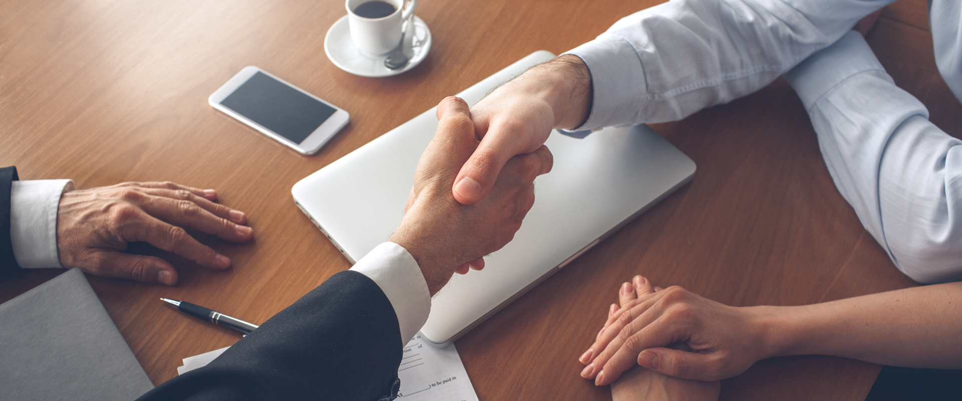 Two People Shaking Hands After an Agreement